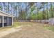Expansive backyard includes a privacy fence, small storage shed, and mature shade trees at 311 Old Stone Ct, Moncks Corner, SC 29461
