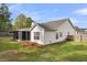 Exterior view of home with screened-in porch, level backyard, and privacy fence at 311 Old Stone Ct, Moncks Corner, SC 29461