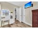 Bright bedroom features a vanity with lighted mirror and wood look flooring at 311 Old Stone Ct, Moncks Corner, SC 29461