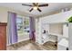 bedroom features a unique lofted bed with built-in desk and storage space and wood look flooring at 311 Old Stone Ct, Moncks Corner, SC 29461