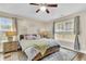 Inviting bedroom with ceiling fan, natural light, and stylish decor, creating a relaxing retreat at 311 Old Stone Ct, Moncks Corner, SC 29461