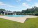 A large community pool with lounge area and shade, perfect for relaxation and recreation at 311 Old Stone Ct, Moncks Corner, SC 29461