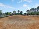 Large, fenced dog park with wood chip ground cover provides a safe space for pets to play at 311 Old Stone Ct, Moncks Corner, SC 29461