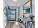 Welcoming entryway features wood floors, a console table with decor, and a view through the open front door at 311 Old Stone Ct, Moncks Corner, SC 29461