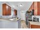 Modern kitchen with stainless steel appliances, wood cabinets, and plenty of counter space at 311 Old Stone Ct, Moncks Corner, SC 29461