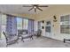 Relaxing screened porch with ceiling fan and comfortable seating area at 311 Old Stone Ct, Moncks Corner, SC 29461