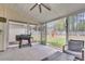 Screened porch with ceiling fan overlooking a backyard at 311 Old Stone Ct, Moncks Corner, SC 29461