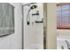 Bathroom shower with white tile and black hardware at 311 Old Stone Ct, Moncks Corner, SC 29461