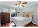 Relaxing bedroom features ceiling fan, natural light, and hardwood floors at 341 W Coleman Blvd # F, Mount Pleasant, SC 29464