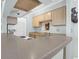 Galley kitchen with eat-in bar and light brown cabinets at 341 W Coleman Blvd # F, Mount Pleasant, SC 29464