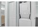 Bright laundry area with stacked washer and dryer, and a closet at 341 W Coleman Blvd # F, Mount Pleasant, SC 29464