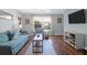 Cozy living room with stylish furniture, hardwood floors, and natural light from a large window at 341 W Coleman Blvd # F, Mount Pleasant, SC 29464