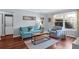 Bright living room with wood floors, comfortable seating, and a large window for natural light at 341 W Coleman Blvd # F, Mount Pleasant, SC 29464