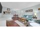 Open-concept living and dining area with hardwood floors, stylish furniture, and plenty of natural light at 341 W Coleman Blvd # F, Mount Pleasant, SC 29464