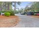 Paved parking lot with shade trees and greenery surrounding the complex at 341 W Coleman Blvd # F, Mount Pleasant, SC 29464