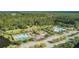 Extensive aerial view showcasing community pools, lush greenery, and amenities in a beautiful, natural setting at 3805 Adrian Way, Mount Pleasant, SC 29466