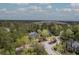 Aerial view of the property in a lush neighborhood with mature trees, showcasing its location at 3805 Adrian Way, Mount Pleasant, SC 29466