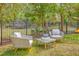 Backyard seating area featuring comfortable chairs, a table, and manicured landscaping, perfect for relaxing at 3805 Adrian Way, Mount Pleasant, SC 29466