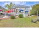 Expansive backyard with a pool, deck, patio, mature trees, and lush green lawn at 3805 Adrian Way, Mount Pleasant, SC 29466