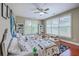 A bedroom featuring hardwood floors, ceiling fan, and two beds with decorative bedding at 3805 Adrian Way, Mount Pleasant, SC 29466