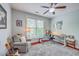 Study area or bonus room with hardwood floors, ceiling fan, work desk, and musical instruments at 3805 Adrian Way, Mount Pleasant, SC 29466