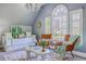 Bright bedroom featuring stylish chairs, a daybed, decorative pillows, and a modern coffee table at 3805 Adrian Way, Mount Pleasant, SC 29466