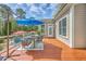 Deck featuring a dining area with a table, chairs, and blue umbrellas, perfect for outdoor entertaining at 3805 Adrian Way, Mount Pleasant, SC 29466