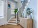 Bright and welcoming entryway featuring a staircase and stylish décor at 3805 Adrian Way, Mount Pleasant, SC 29466