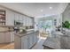 Charming kitchen boasts granite countertops, stainless appliances, kitchen island and eat in nook filled with sunlight at 3805 Adrian Way, Mount Pleasant, SC 29466