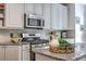 Granite countertops highlight this well-equipped kitchen with stainless appliances, ample storage and lots of workspace at 3805 Adrian Way, Mount Pleasant, SC 29466