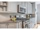 This well-equipped kitchen features granite countertops, stainless appliances, lots of counter space and storage at 3805 Adrian Way, Mount Pleasant, SC 29466