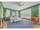 Spacious main bedroom featuring hardwood floors, a ceiling fan, and large windows at 3805 Adrian Way, Mount Pleasant, SC 29466