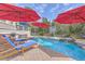 Lounge chairs line the backyard swimming pool with a brick surround, perfect for relaxing and enjoying the outdoors at 3805 Adrian Way, Mount Pleasant, SC 29466