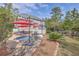 Relaxing backyard with a swimming pool, lounge chairs, and lush landscaping for ultimate outdoor enjoyment at 3805 Adrian Way, Mount Pleasant, SC 29466