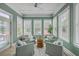 Bright sunroom filled with lots of natural light, comfortable seating and relaxing decor throughout at 3805 Adrian Way, Mount Pleasant, SC 29466