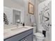 Bathroom with framed art over toilet and decorative shower curtain at 3873 Newhall St, Mount Pleasant, SC 29466