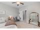 Bright bedroom featuring a keyboard, plush bedding, and decorative mirror, creating a cozy and inviting atmosphere at 3873 Newhall St, Mount Pleasant, SC 29466