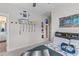 Bedroom with ceiling fan, lacrosse decor, and door to bathroom at 3873 Newhall St, Mount Pleasant, SC 29466