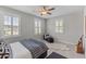 Cozy bedroom featuring neutral tones, plantation shutters, and a comfortable lounge chair at 3873 Newhall St, Mount Pleasant, SC 29466