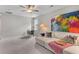 Bonus room with sofa, ceiling fan, side table, and brightly colored painting at 3873 Newhall St, Mount Pleasant, SC 29466