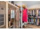 Walk-in closet features custom shelving, hanging racks, and a personal sauna at 3873 Newhall St, Mount Pleasant, SC 29466