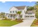 Beautiful two-story home with a well-maintained lawn, driveway, and attached two car garage at 3873 Newhall St, Mount Pleasant, SC 29466