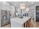 Bright kitchen featuring white cabinets, stainless appliances, and a large central island with seating at 3873 Newhall St, Mount Pleasant, SC 29466