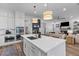 Bright kitchen with white cabinetry, a large island with seating, and stainless steel appliances at 3873 Newhall St, Mount Pleasant, SC 29466