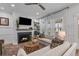 Cozy living room with a fireplace, large windows, comfortable seating, and elegant decor at 3873 Newhall St, Mount Pleasant, SC 29466