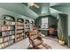 Spacious home office with built-in bookshelves, a ceiling fan, and two desks with office chairs at 3873 Newhall St, Mount Pleasant, SC 29466
