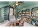 Cozy home office with built-in bookshelves and stairs leading to another floor of the house at 3873 Newhall St, Mount Pleasant, SC 29466