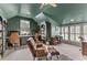 Spacious home office with built-in bookshelves, a ceiling fan, and two desks with office chairs at 3873 Newhall St, Mount Pleasant, SC 29466