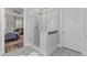Modern glass shower in bathroom with decorative tile and seamless access to the Primary bedroom at 3873 Newhall St, Mount Pleasant, SC 29466