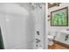 Bathroom includes a shower, toilet, sink and window, designed for functionality and comfort at 394 Shoofly Rd, Ridgeville, SC 29472